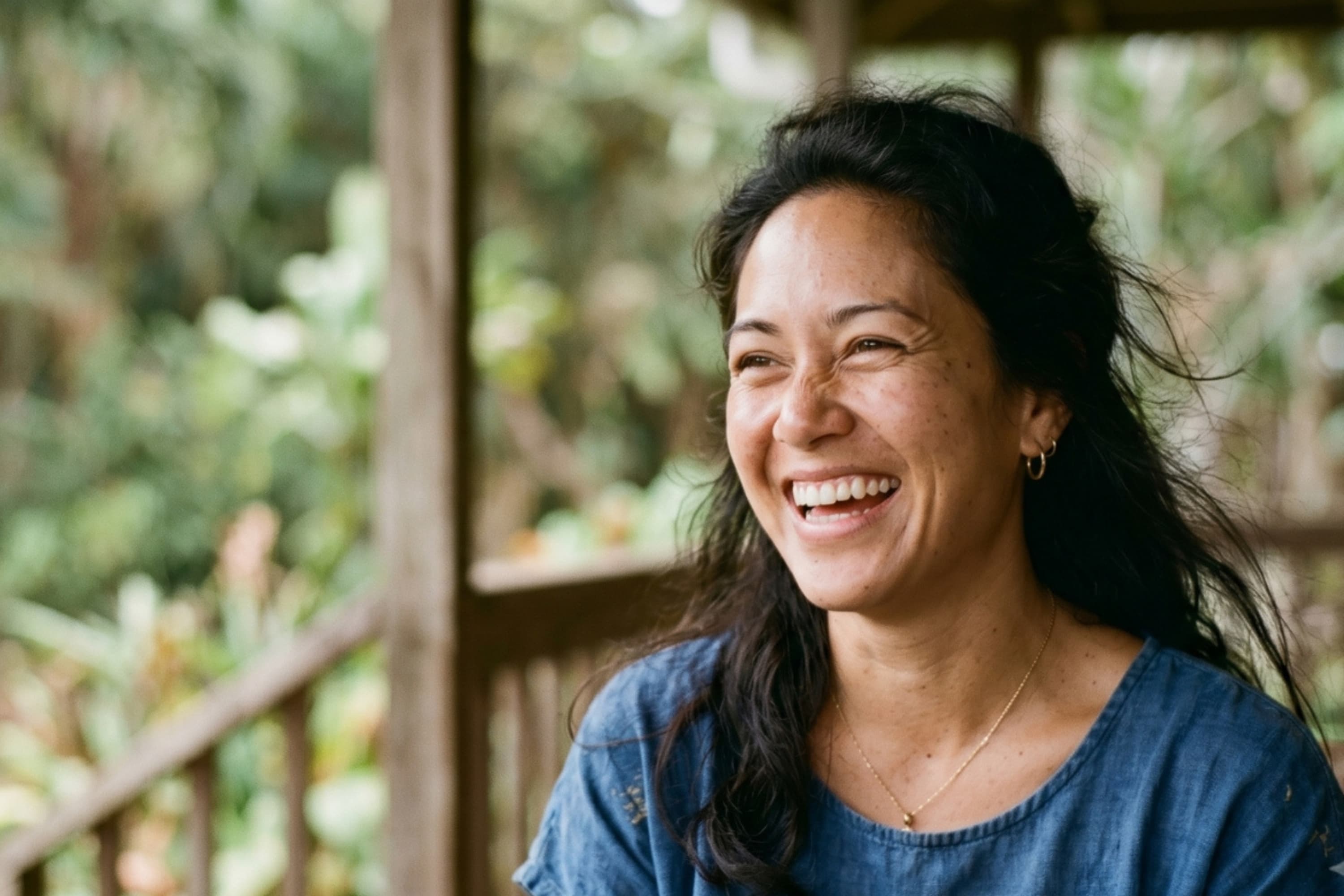 A smiling Hawaiʻi woman in a calm outdoor setting